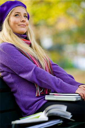 simsearch:6102-03828834,k - A woman sitting on bench in a park using a laptop, Stockholm, Sweden. Stock Photo - Premium Royalty-Free, Code: 6102-03828990
