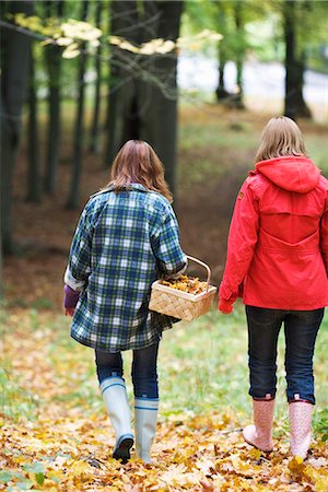 Mother and daughter walking in a forest, Stockholm, Sweden. Stock Photo - Premium Royalty-Free, Code: 6102-03829049