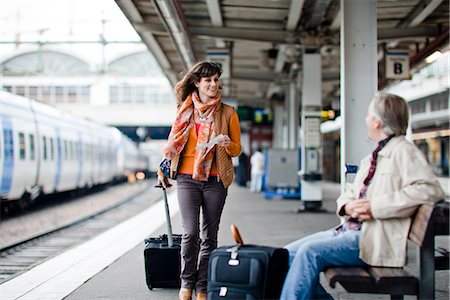 A man and woman on a platform at a railway station, Sweden. Stock Photo - Premium Royalty-Free, Code: 6102-03829094