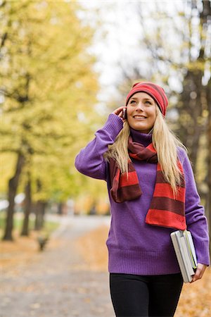 student walking not backpack not elementary not campus not indoors - A woman talking in a cell phone, Sweden. Stock Photo - Premium Royalty-Free, Code: 6102-03829005