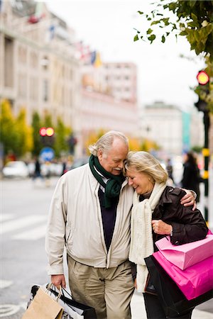 senior couple shopping outside - A senior couple carrying shopping bags, Stockholm, Sweden. Stock Photo - Premium Royalty-Free, Code: 6102-03829160