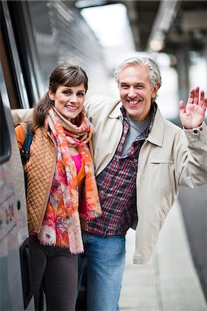 A couple by a train at a railway station, Sweden. Stock Photo - Premium Royalty-Free, Code: 6102-03829121