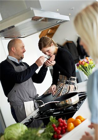 Woman tasting dinner, Sweden. Stock Photo - Premium Royalty-Free, Code: 6102-03904073