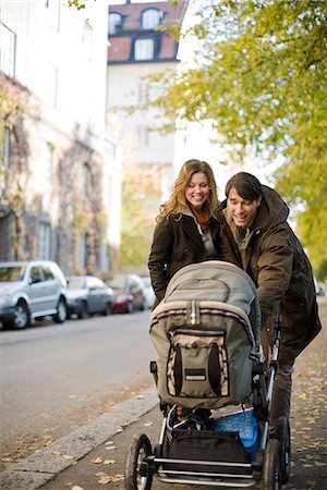 A couple taking a walk with their baby, Sweden. Stock Photo - Premium Royalty-Free, Code: 6102-03904196