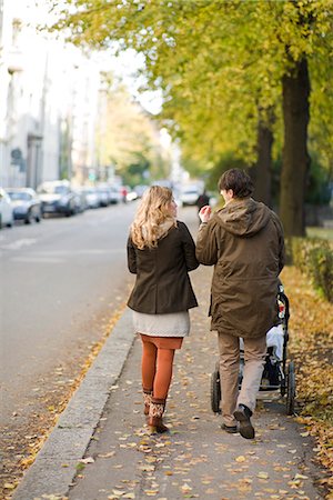 stroller - A couple taking a walk with their baby, Sweden. Stock Photo - Premium Royalty-Free, Code: 6102-03904199