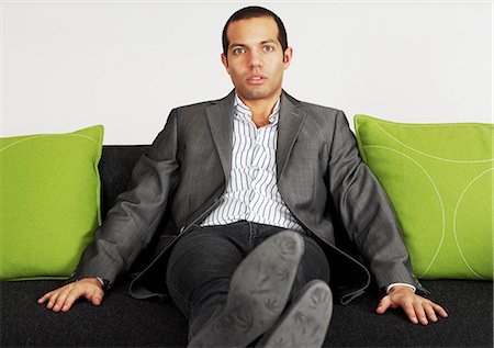 shoes on couch - Portrait of a businessman, Sweden. Stock Photo - Premium Royalty-Free, Code: 6102-03904125