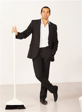 Businessman with a broom, Sweden. Stock Photo - Premium Royalty-Free, Code: 6102-03904139