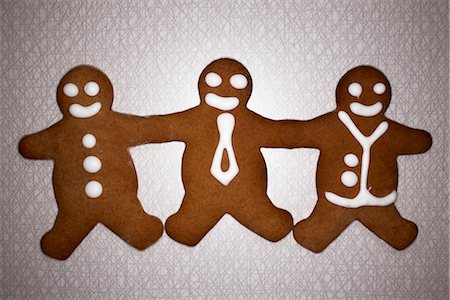 Three gingerbread men hand in hand, Denmark. Stock Photo - Premium Royalty-Free, Code: 6102-03904252