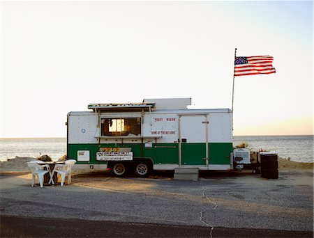 A kiosk by the sea at sunset, USA. Stock Photo - Premium Royalty-Free, Code: 6102-03904347