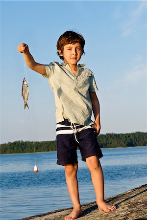 simsearch:6102-03867416,k - A boy with a roach, Sweden. Stock Photo - Premium Royalty-Free, Code: 6102-03904387