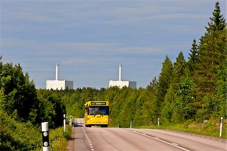 A bus on a country road close to Forsmark Nuclear Power Plant, Sweden. Stock Photo - Premium Royalty-Free, Code: 6102-03904389