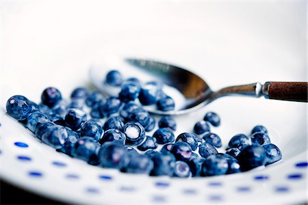dessert on a white spoon - Bilberry and milk, close-up, Sweden. Stock Photo - Premium Royalty-Free, Code: 6102-03904391