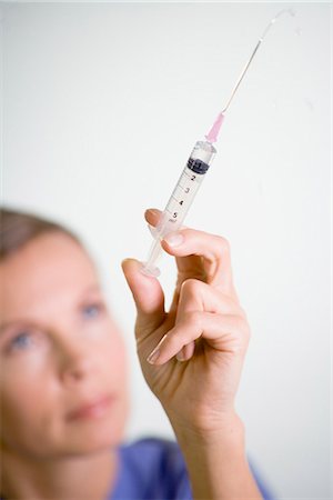 female nurse inject woman - Nurse preparing injection, close-up. Stock Photo - Premium Royalty-Free, Code: 6102-03904303