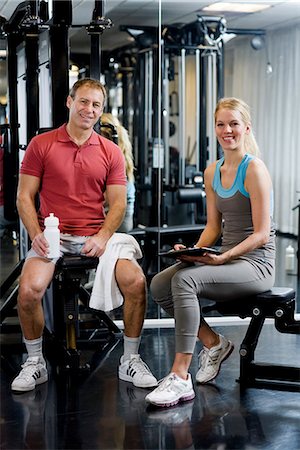 simsearch:6102-03904476,k - A man and a woman weight training at a gym, Sweden. Stock Photo - Premium Royalty-Free, Code: 6102-03904472