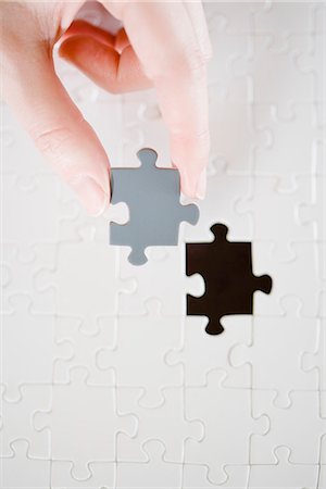 puzzle pieces hand - A puzzle with a missing piece. Stock Photo - Premium Royalty-Free, Code: 6102-03904430