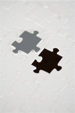 A puzzle with a missing piece. Stock Photo - Premium Royalty-Free, Code: 6102-03904432