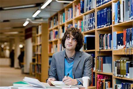 public library - A male student in a library, Sweden. Stock Photo - Premium Royalty-Free, Code: 6102-03904570