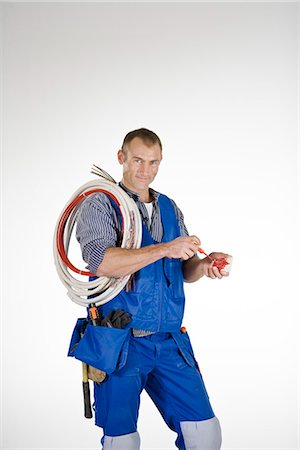electrical cord - Portrait of an electrician. Stock Photo - Premium Royalty-Free, Code: 6102-03904503