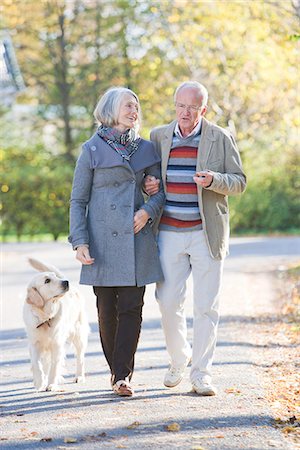 senior with dogs - Senior couple taking a walk, Sweden. Stock Photo - Premium Royalty-Free, Code: 6102-03904709