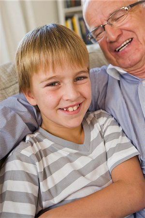 Grandfather and grandson in a sofa, Sweden. Stock Photo - Premium Royalty-Free, Code: 6102-03904718