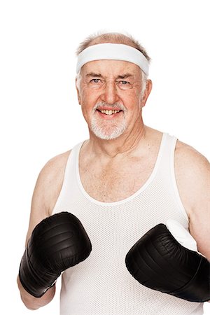 simsearch:6102-03828583,k - Senior man with boxing gloves. Fotografie stock - Premium Royalty-Free, Codice: 6102-03904861
