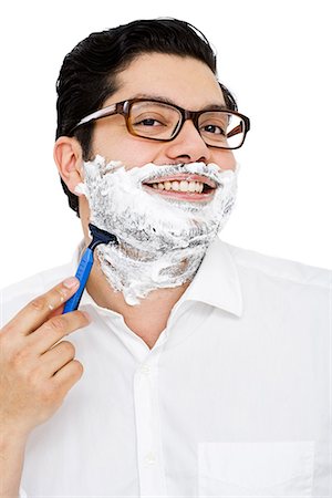 espuma de afeitar - A man shaving. Foto de stock - Sin royalties Premium, Código: 6102-03904896