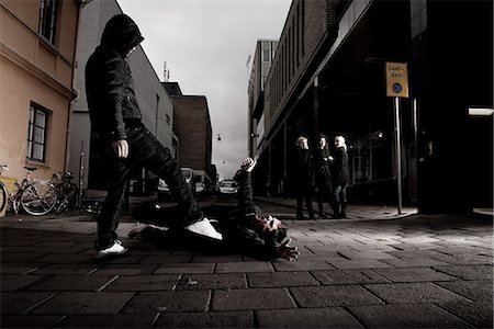 dark city streets - Young people fighting in the streets at night, Sweden. Stock Photo - Premium Royalty-Free, Code: 6102-03905043