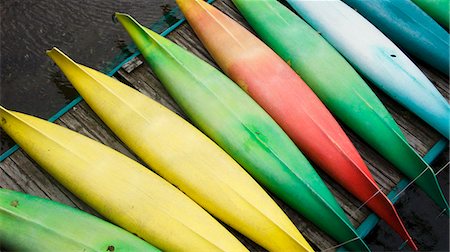 Kayaks in different colors on a jetty, Sweden. Stock Photo - Premium Royalty-Free, Code: 6102-03905058