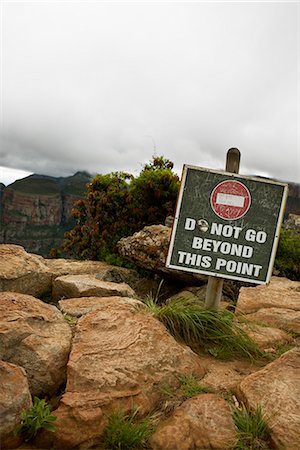 Warning sign by a canyon, South Africa. Stock Photo - Premium Royalty-Free, Code: 6102-03905008