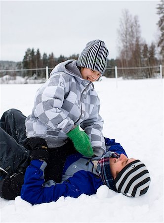 Father and son playing in the snow, Sweden. Stock Photo - Premium Royalty-Free, Code: 6102-03905104