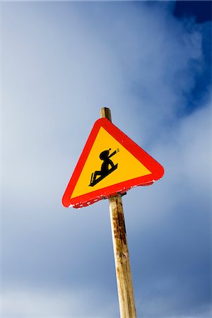 simsearch:6102-03905124,k - Road sign warning against children on pulkas, Sweden. Stock Photo - Premium Royalty-Free, Code: 6102-03905124