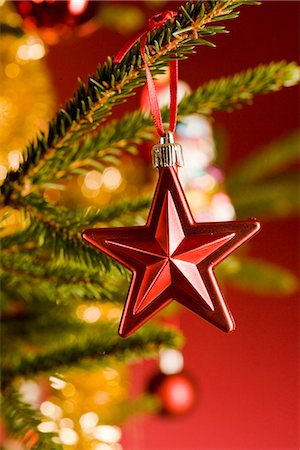 star ornament - A close-up of a decorated Christmas tree. Stock Photo - Premium Royalty-Free, Code: 6102-03905289