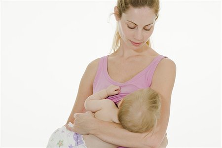 ponytail babies - Mother breastfeeding her baby. Stock Photo - Premium Royalty-Free, Code: 6102-03905219