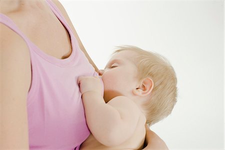 Mother breastfeeding her baby. Stock Photo - Premium Royalty-Free, Code: 6102-03905224