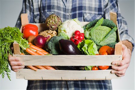 fruit and vegetable - Man holding a box of vegetables. Stock Photo - Premium Royalty-Free, Code: 6102-03905382