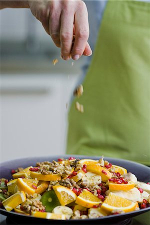 Woman making a fruit salad, Sweden. Stock Photo - Premium Royalty-Free, Code: 6102-03905459