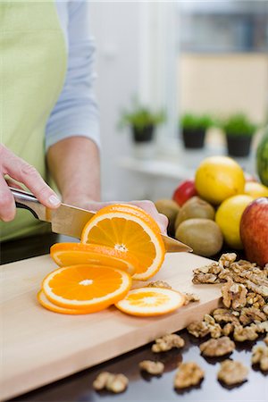 simsearch:6102-08000911,k - Woman making a fruit salad, Sweden. Stock Photo - Premium Royalty-Free, Code: 6102-03905467