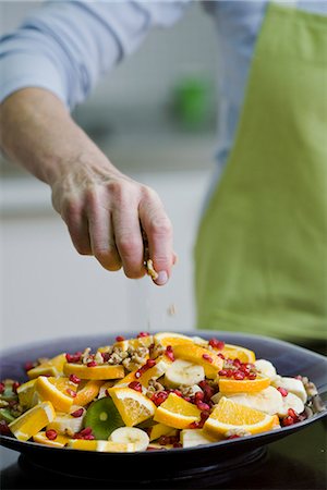 Woman making a fruit salad, Sweden. Stock Photo - Premium Royalty-Free, Code: 6102-03905469