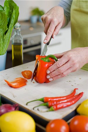 Woman cutting up vegetables, Sweden. Stock Photo - Premium Royalty-Free, Code: 6102-03905484