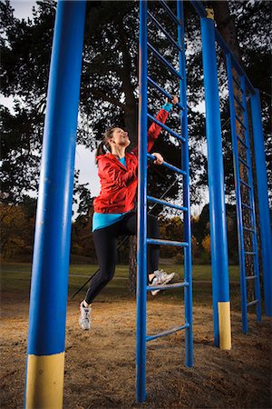 person climbing the ladder - Woman climbing on ladder Stock Photo - Premium Royalty-Free, Code: 6102-03905982