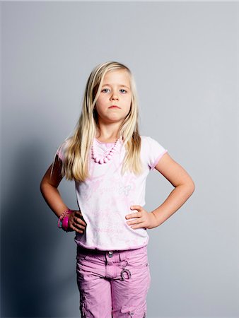 picture tongue kids - Proud girl standing with hands on hip Stock Photo - Premium Royalty-Free, Code: 6102-03905905