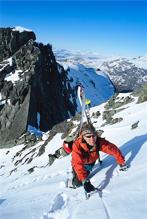 Skier climbing mountain Stock Photo - Premium Royalty-Free, Code: 6102-04929296