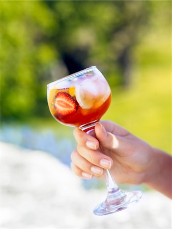 simsearch:6102-05655416,k - Human hand holding glass of drink Stock Photo - Premium Royalty-Free, Code: 6102-04929362