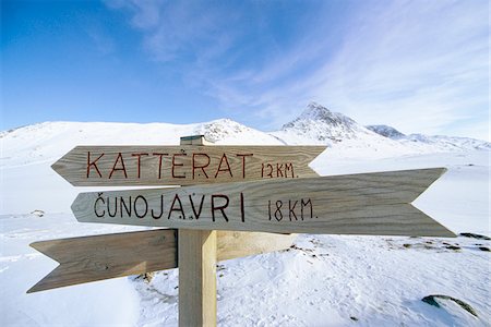 signs direction - Wooden direction sign in winter mountain scenery Stock Photo - Premium Royalty-Free, Code: 6102-04929315