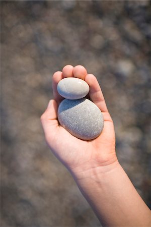 Picking Stone, Manzanita, Tillamook County, Oregon, USA - Stock