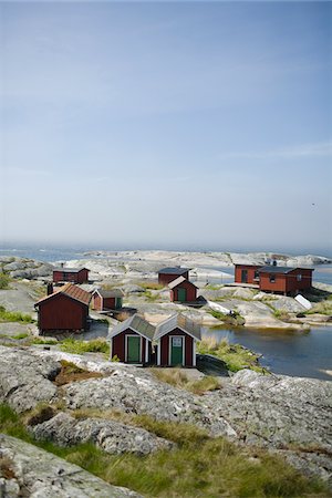 Cottages on rock by sea Foto de stock - Sin royalties Premium, Código: 6102-04929633