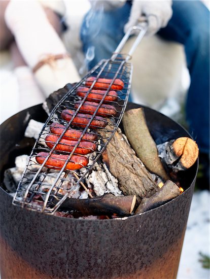 Barbecuing sausages, close-up Stock Photo - Premium Royalty-Free, Image code: 6102-04929792