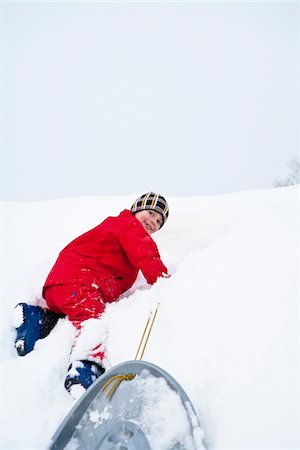 simsearch:6102-03905124,k - Boy playing on snow Stock Photo - Premium Royalty-Free, Code: 6102-04929862