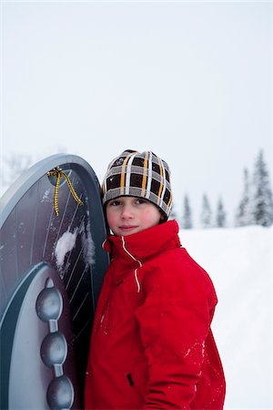 simsearch:6102-03905124,k - Boy playing on snow Stock Photo - Premium Royalty-Free, Code: 6102-04929870