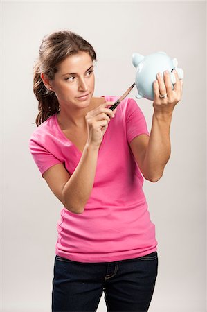 save the day - A woman with a savings box Stock Photo - Premium Royalty-Free, Code: 6102-05655519